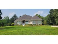 Charming one-story home features a well manicured lawn and a welcoming entrance at 5690 Rutland Trce, Lithonia, GA 30058