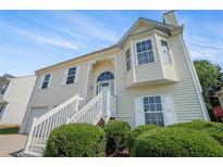 Charming home featuring white siding, a bay window, and a well-manicured front yard at 7835 Teton Trl, Douglasville, GA 30134