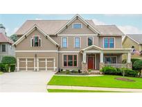 Charming two-story home with a manicured lawn, two-car garage and inviting front porch at 2850 Seagrave Way, Marietta, GA 30066
