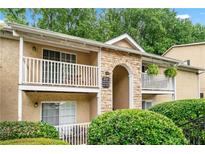 Charming condo building with inviting patios and manicured landscaping at 3115 Seven Pines Ct # 308, Atlanta, GA 30339