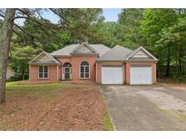 Charming brick home featuring a two-car garage and traditional design at 288 Old Burnt Hickory Rd, Acworth, GA 30101