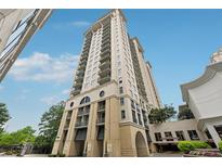 Stunning view of the high-rise building with attractive stone accents and private terraces overlooking the city at 3040 Peachtree Rd, Atlanta, GA 30305