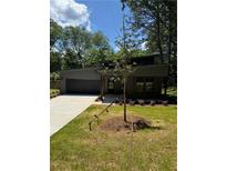 Charming single-story home with a modern design, well-manicured lawn, and ample curb appeal at 2588 Abner Nw Pl, Atlanta, GA 30318