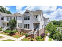 Charming two-story home with landscaped front yard, inviting curb appeal at 767 Farmstead Rd, Suwanee, GA 30024