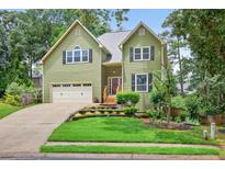 Charming two-story home with a well-manicured lawn and inviting curb appeal at 1876 Hamby Place Nw Dr, Acworth, GA 30102