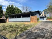 Sunroom on a single-Gathering home with backyard at 4931 Happy Hollow Rd, Atlanta, GA 30360