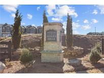 The Enclave at Azalea Hills community sign with beautiful landscaping and sunny skies at 241 Ivey Ter, Temple, GA 30179
