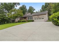 Inviting home with a long driveway and an attached two-car garage at 3711 Frey Lake Nw Rd, Kennesaw, GA 30144