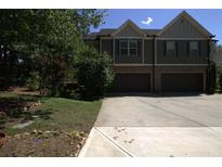 Inviting two-story home featuring a two-car garage and traditional architecture at 4746 Highland Ave, Sugar Hill, GA 30518