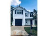 Charming two-story home with dark shutters and a beautifully maintained yard at 1188 To Lani Path, Stone Mountain, GA 30083