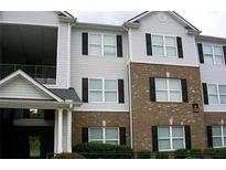Exterior view of a two-story apartment building with black shutters and a brick facade at 10103 Waldrop Pl, Decatur, GA 30034
