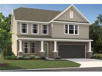 Charming two-story home with a covered porch, attached garage, and landscaped front yard at 7204 Eton Ln, Locust Grove, GA 30248