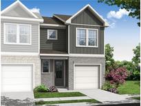 New construction townhome showcasing gray siding, brick accents, and manicured landscaping at 512 Crown Dr, Emerson, GA 30137