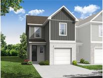 Two-story townhome featuring mixed siding, a garage, and a well-manicured lawn at 510 Crown Dr, Emerson, GA 30137