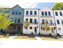 Charming townhomes feature modern design, balconies, and beautifully landscaped front yards at 970 Bibbs Circle Nw # 12, Atlanta, GA 30318