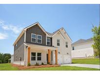 Beautiful two-story home featuring a covered front porch with wood columns and a two-car garage at 342 Orwell Drive Lot 95, Social Circle, GA 30025