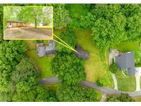 Overhead shot of the property showcasing lush landscaping and tree coverage at 3927 Buck Rd, Powder Springs, GA 30127