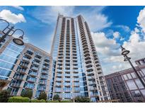 Stunning exterior view of modern high rise building with reflective glass and balconies at 400 W Peachtree Nw St # 3711, Atlanta, GA 30308