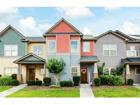 Charming townhouse with colorful exterior, landscaped front yard, and welcoming entryway at 4206 Mastic Pt # 24, Acworth, GA 30101