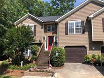 Charming two-story home featuring manicured landscaping and a welcoming front entrance at 1784 Virginia Grove Ln, Lawrenceville, GA 30045