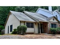 Charming home featuring a mix of siding and brick, complemented by lush landscaping and a welcoming entrance at 1106 Shiloh Nw Ln, Kennesaw, GA 30144
