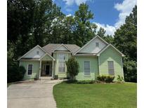 Charming home with a well-manicured front yard and a welcoming entrance at 235 Pirkle Ct, Cumming, GA 30040