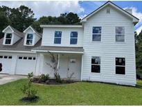 Charming two-story home with a manicured lawn and inviting curb appeal at 433 Rhett Dr, Loganville, GA 30052