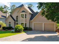 Charming two-story home with a two-car garage, bay window, and beautiful landscaping at 1313 Fallsbrook Nw Ter, Acworth, GA 30101