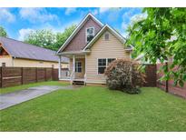 Charming craftsman-style home with a well-manicured front yard and inviting porch at 2005 Chicago Nw Ave, Atlanta, GA 30314