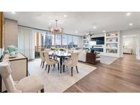 Bright and airy living room with hardwood floors, elegant decor, and a stunning city view at 700 Park Regency Ne Pl # 1605, Atlanta, GA 30326