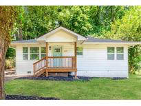 Charming single-story home with a welcoming front porch and fresh white exterior at 2879 Harlan Dr, Atlanta, GA 30344