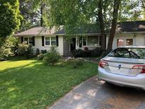 Charming single-story home with lush lawn, mature trees, and a welcoming front entrance at 2920 Appling Dr, Atlanta, GA 30341
