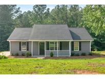 Charming single-story home with gray siding, black shutters and well-manicured lawn at 69 Southern Trace Way, Rockmart, GA 30153