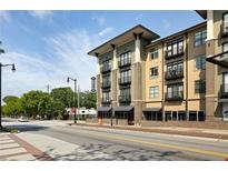 Modern apartment building showcasing architectural design and streetscape appeal at 5300 Peachtree Rd # 3207, Chamblee, GA 30341