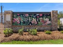 A welcoming community sign with floral design and the word Serenity at 925 Willingham Dr # 13, Hapeville, GA 30354