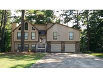 Charming home featuring a two-car garage and beautiful architectural details at 2297 Horseshoe Bend Sw Rd, Marietta, GA 30064