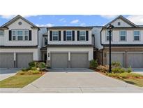 Charming townhome with two-car garage and well-manicured landscaping at 3560 Bexton Dr, Duluth, GA 30097