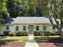 Charming single-story home with well-manicured front yard and classic architectural details at 1590 Sunnybrook Farm Road Rd, Atlanta, GA 30350