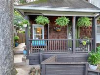 Charming front porch with hanging ferns and bench seating creates a welcoming entrance at 770 Barnett Street Ne, Atlanta, GA 30306