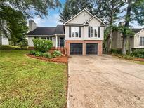 Charming two-story home with a two-car garage and a well-manicured front yard at 5021 Rodrick Trce, Marietta, GA 30066