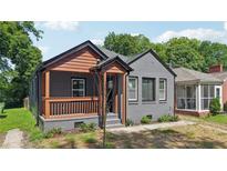 Charming gray brick bungalow with a covered front porch and well-maintained landscaping at 524 Paines Nw Ave, Atlanta, GA 30318