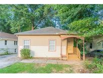 Charming single-story home with a welcoming front porch and freshly cut grass at 132 Brownlee Sw Rd, Atlanta, GA 30331