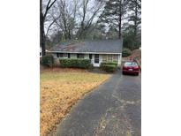 Charming single story home with a private driveway and mature landscaping at 1088 Palafox Ne Dr, Atlanta, GA 30324