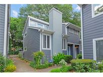 Charming gray two-story home with landscaped yard and inviting walkway leading to the entrance at 836 Saint Charles Ne Ave # I, Atlanta, GA 30306