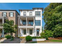 Beautiful white modern home with dual front porches and manicured landscaping at 100 Villa Magnolia Ln, Alpharetta, GA 30009