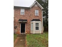 Charming two-story brick home with well-maintained landscaping and a welcoming front entrance at 776 Crestside Ct, Austell, GA 30168
