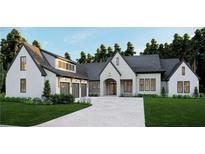 Stunning new build boasts a three-car garage, stone facade, and lush landscaping at 4585 Ryker Rd, Cumming, GA 30041