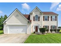 Charming two-story home with an attached two-car garage, manicured lawn, and classic shuttered windows at 150 Crestworth Xing, Powder Springs, GA 30127