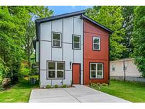 Contemporary home with a well-manicured lawn, modern siding, and ample parking space at 1835 Taylor Ave, East Point, GA 30344