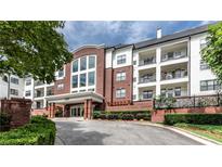 A beautiful building exterior with manicured landscaping and brick facade at 3275 Lenox Ne Rd # 413, Atlanta, GA 30324